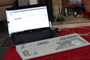 The Model M next to my laptop